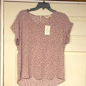 Women’s blouse. Mauve with flowers.